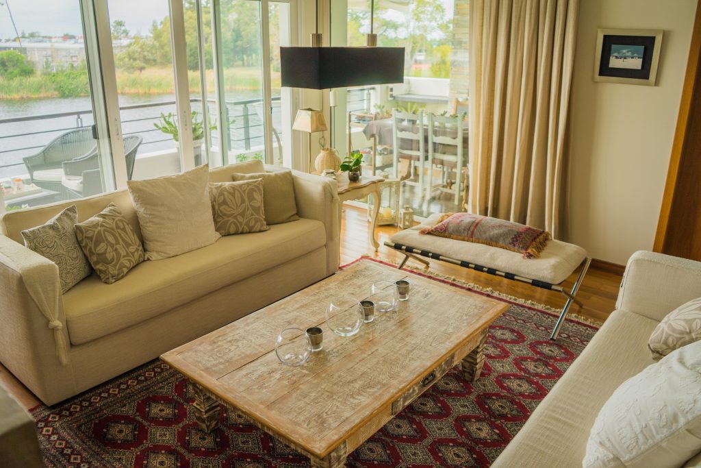 interior modern apartment decorated comfortably with huge windows min